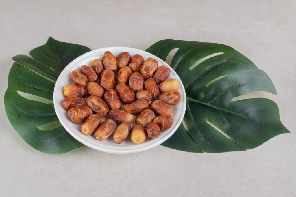 Yellow dry dates in a ceramic bowl